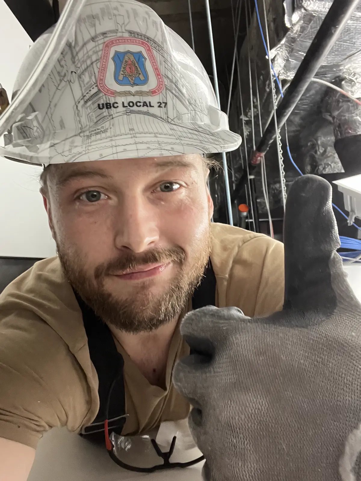 Opus Keystone installer on site wearing a union local hard hat