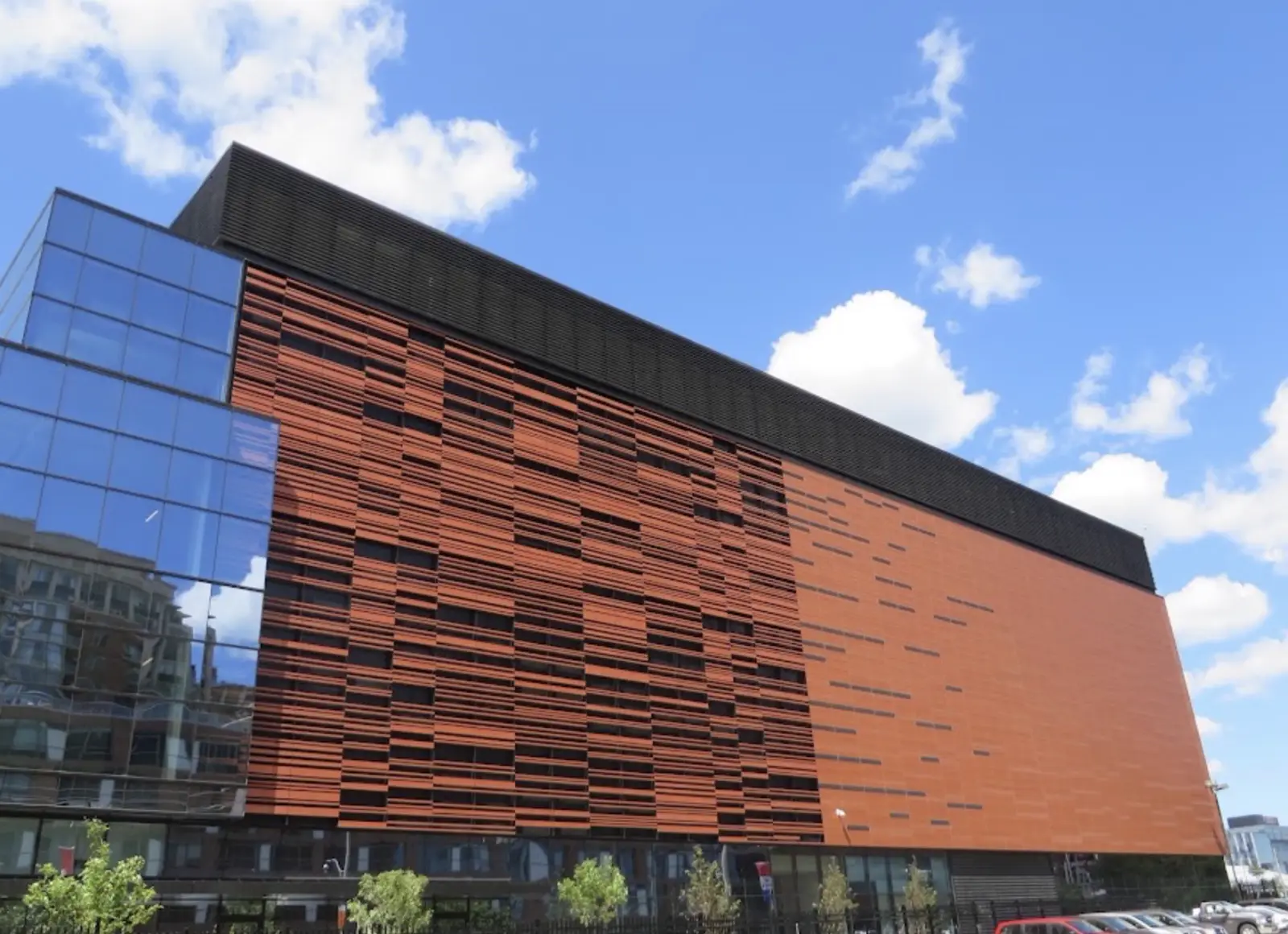 Completed copper-tone louvre and panel facade